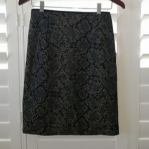 MNG black, blue, and tan patterned skirt.